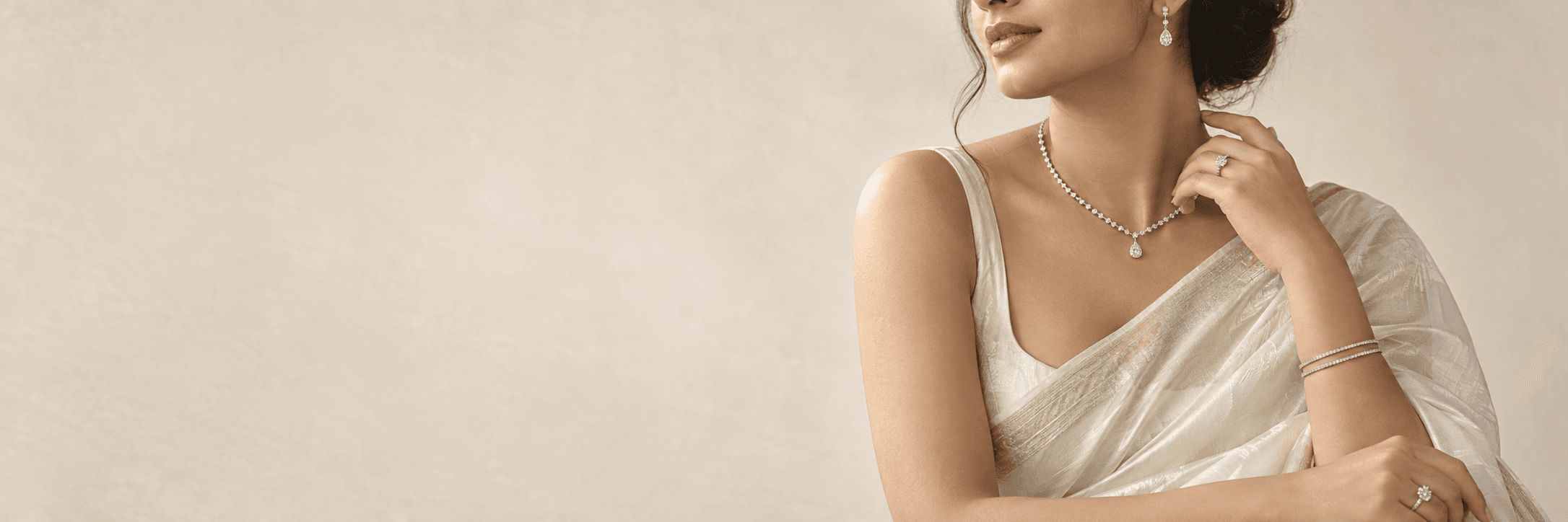 Woman wearing Pacific Diamonds necklaces, earrings, rings and bangles